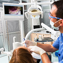 Dentist using an intraoral camera