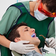 Dentist showing male patient his digital dental x-rays
